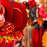 A lively market scene in Phuket at night with stalls filled with traditional crafts and souvenirs.