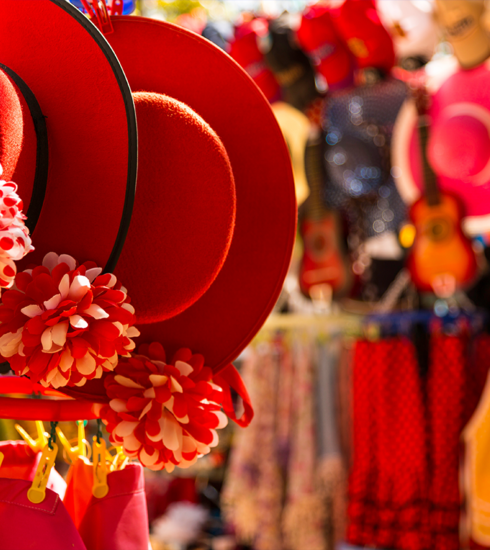 A lively market scene in Phuket at night with stalls filled with traditional crafts and souvenirs.