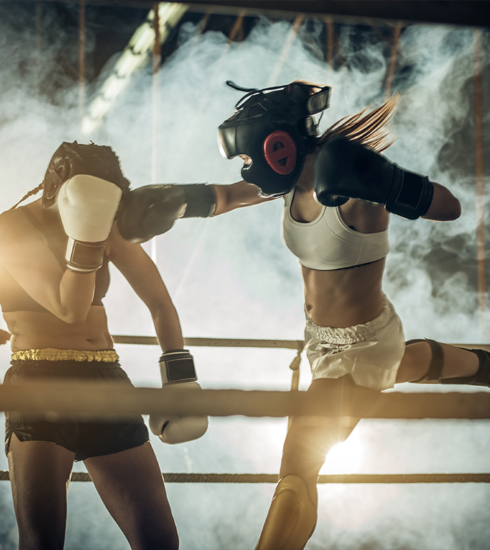 Fighters practicing Muay Thai techniques during a training session in Phuket.