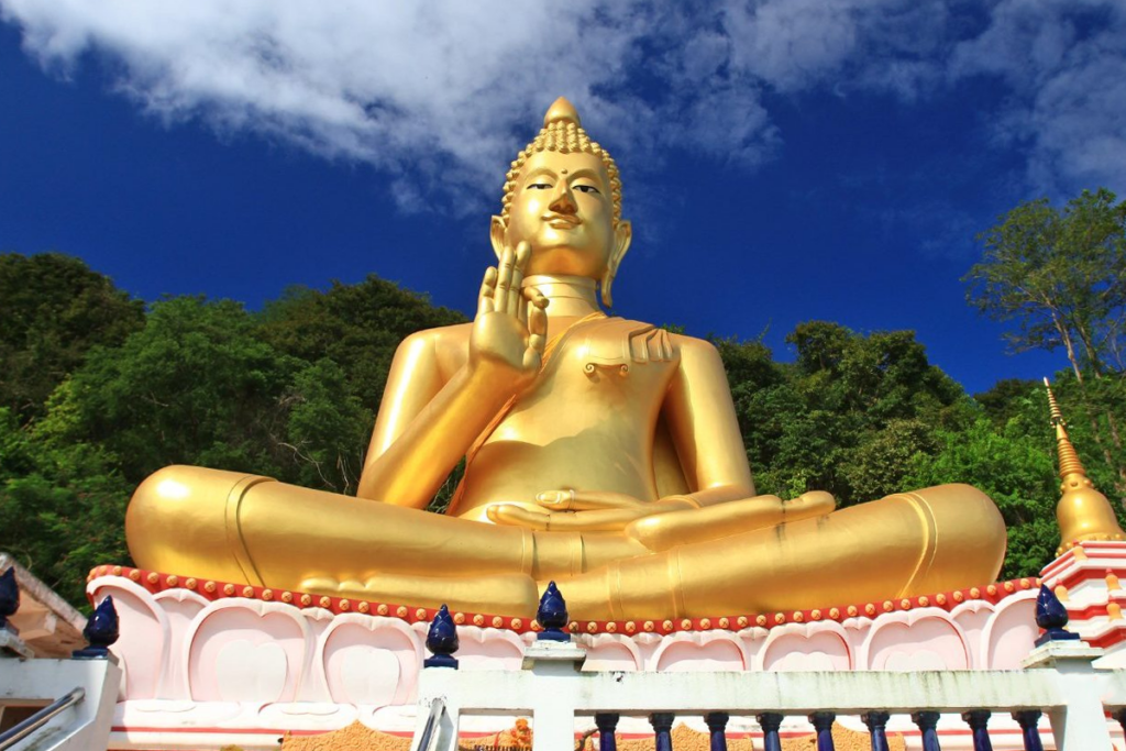 Wat Khao Rang in Phuket, showcasing a golden sitting Buddha with scenic views